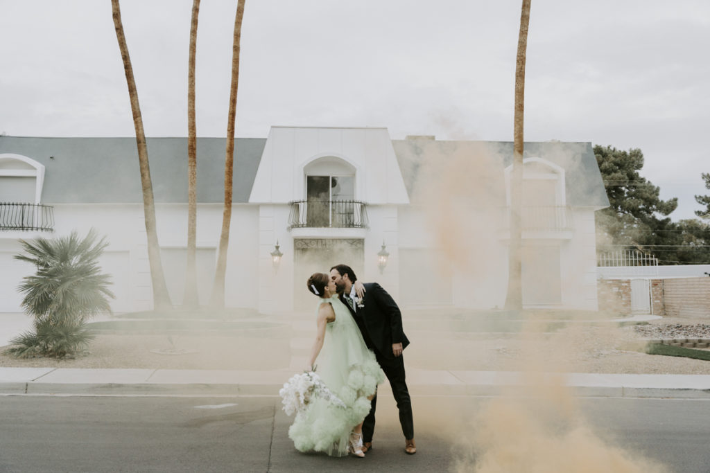 bride and groom kiss