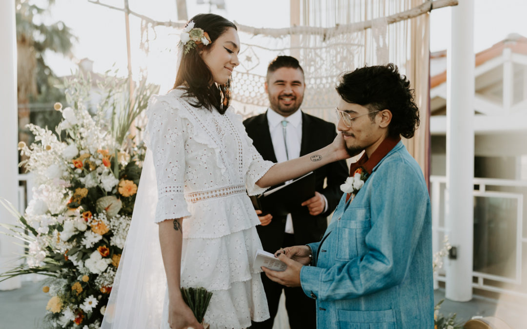 couple exchanging vows in vintage clothes