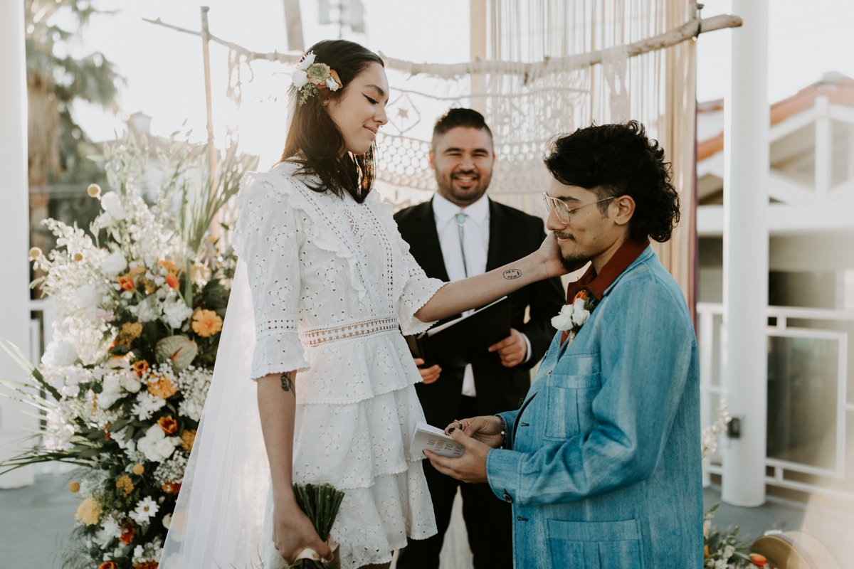 couple exchanging vows in vintage clothes