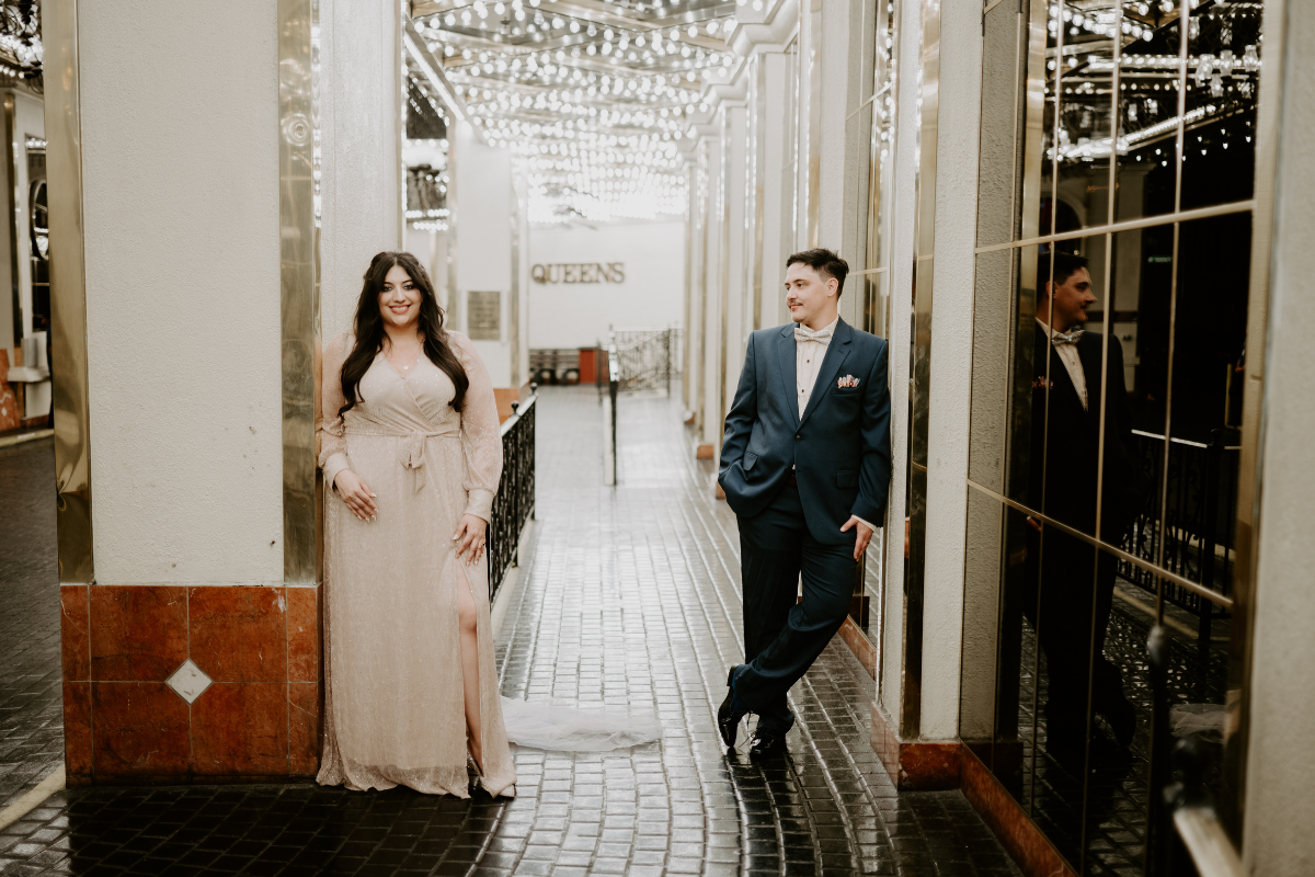 a bride and groom do a portrait session on the streeets of downtown las vegas and are comfortable on camera on their wedding day.